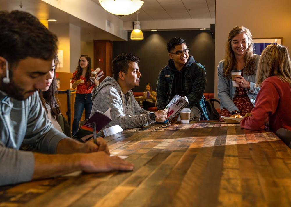 Students in a cafe on Saint Mary's College Campus talking