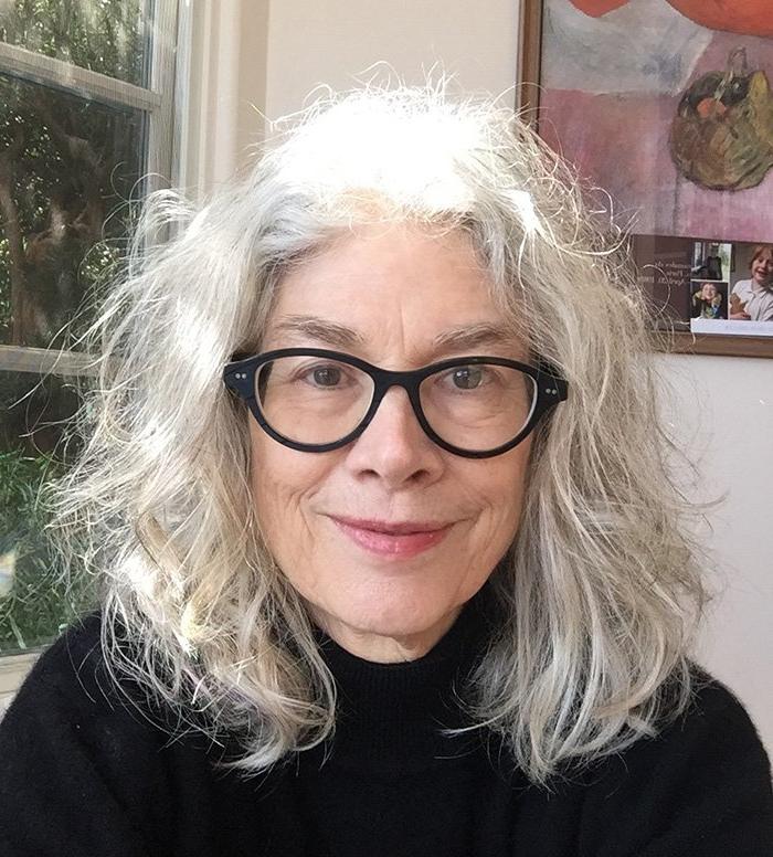 Headshot photo of Prof. Brenda Hillman in front of a window