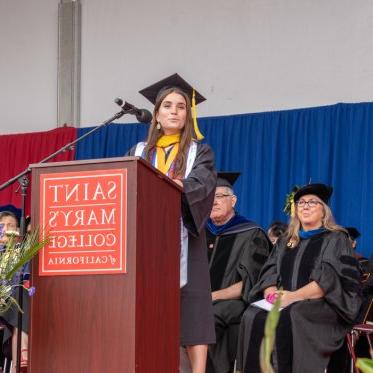 The valedictorian speaking at the podium